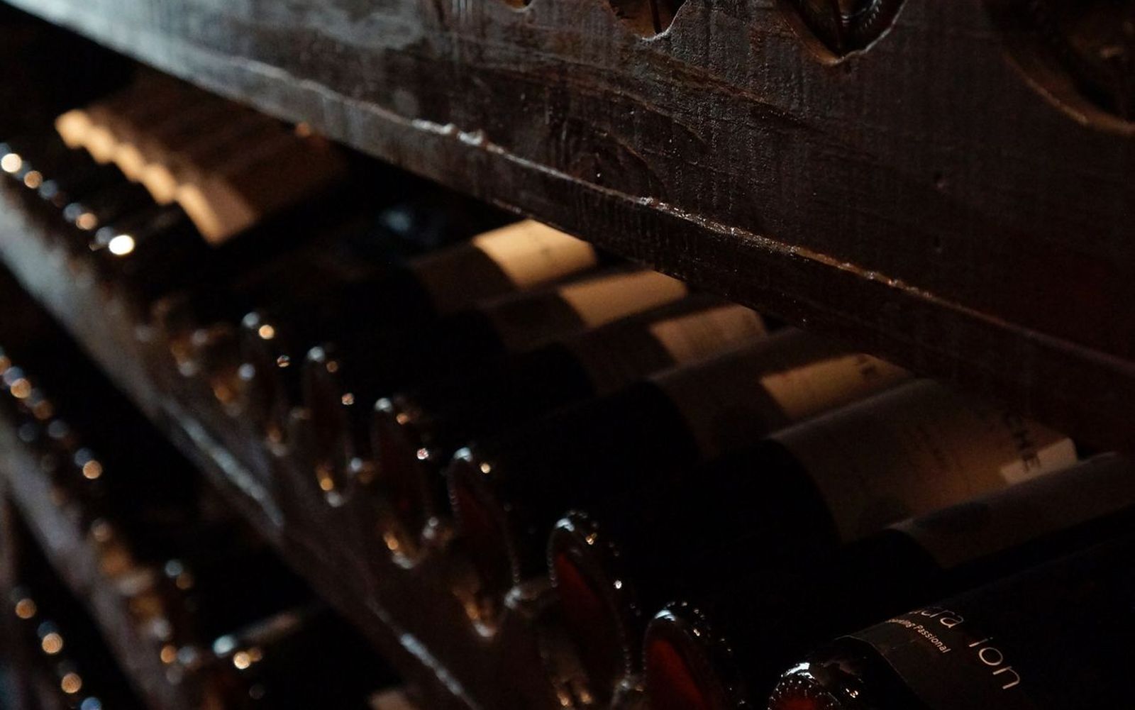 Bottles ageing in a dark cellar